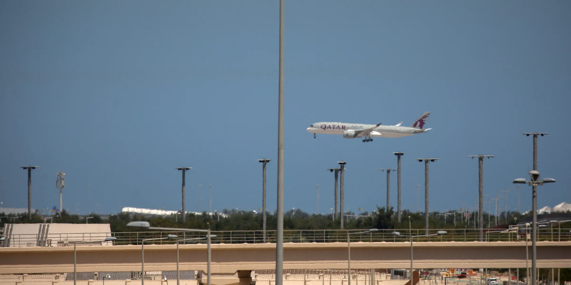 A Qatar Airways plane lands at Hamad International Airport in Doha on March 22, 2026. Photo: Stringer/picture alliance via Getty Images