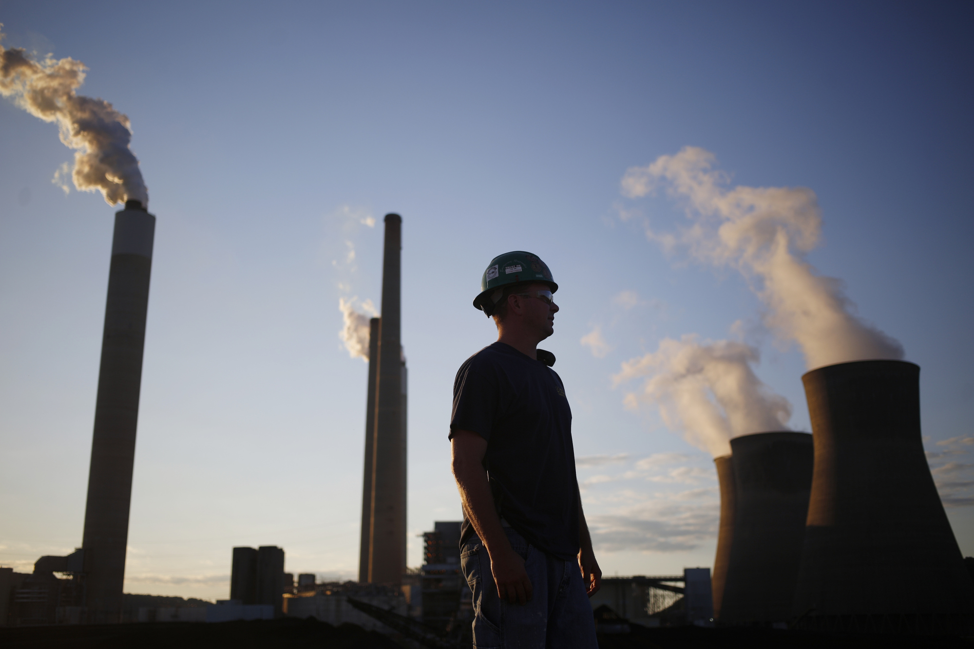A worker stands in the coal yard at the John E. Amos Power Plant in Winfield, West Virginia.Photographer: Luke Sharrett/Bloomberg