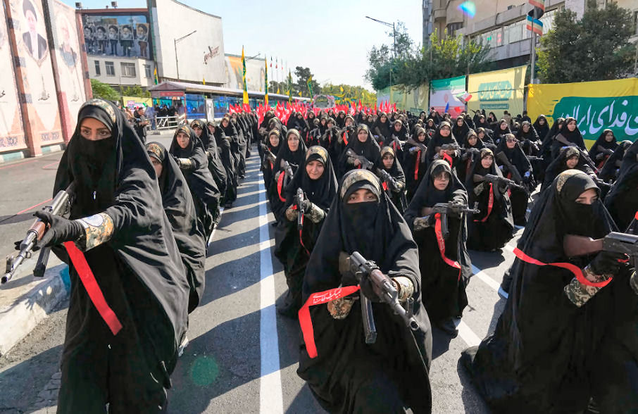 The government-organized rally was a chance for Iran to show off military hardware. Female members of Iran's Revolutionary Guard displayed weapons during a parade in Tehran on Friday.Vahid Salemi / AP