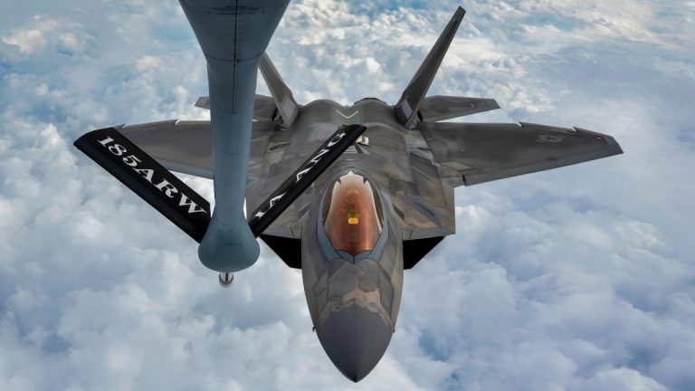 A U.S. Air Force F-22 Raptor approaches the boom of a KC-135 Stratotanker during a refueling mission over the Florida Panhandle, Dec. 14, 2022. Aerial refueling allows pilots to stay airborne for longer periods of time, increasing the mission capabilities individual aircraft can support. (U.S. Air Force photo by Tech. Sgt. Betty R. Chevalier) A U.S. Air Force F-22 Raptor approaches the boom of a KC-135 Stratotanker during a refueling mission over the Florida Panhandle, Dec. 14, 2022. Aerial refueling allows pilots to stay airborne for longer periods of time, increasing the mission capabilities individual aircraft can support. (U.S. Air Force photo by Tech. Sgt. Betty R. Chevalier)
